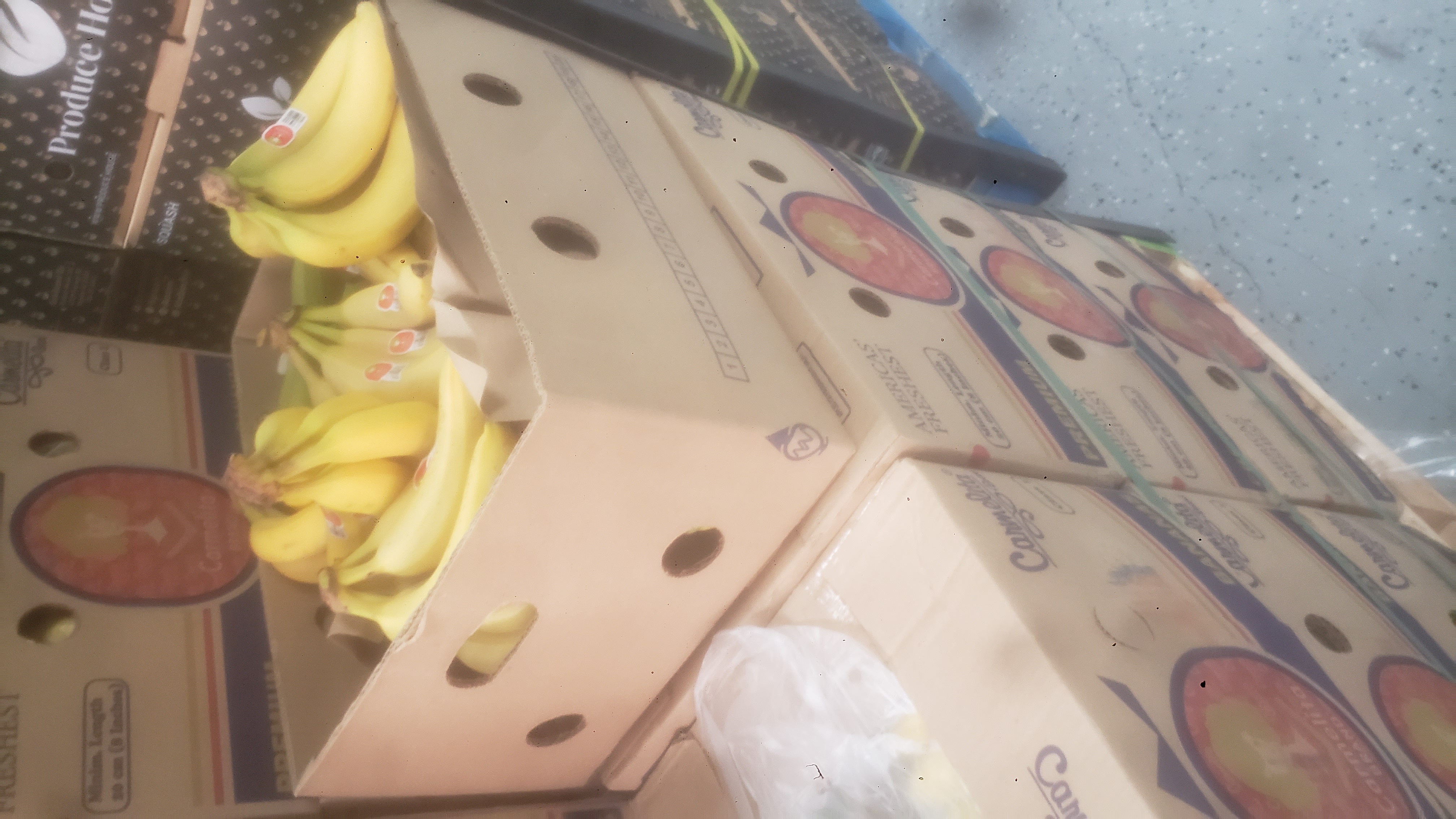 Banana boxes filled with bananas.